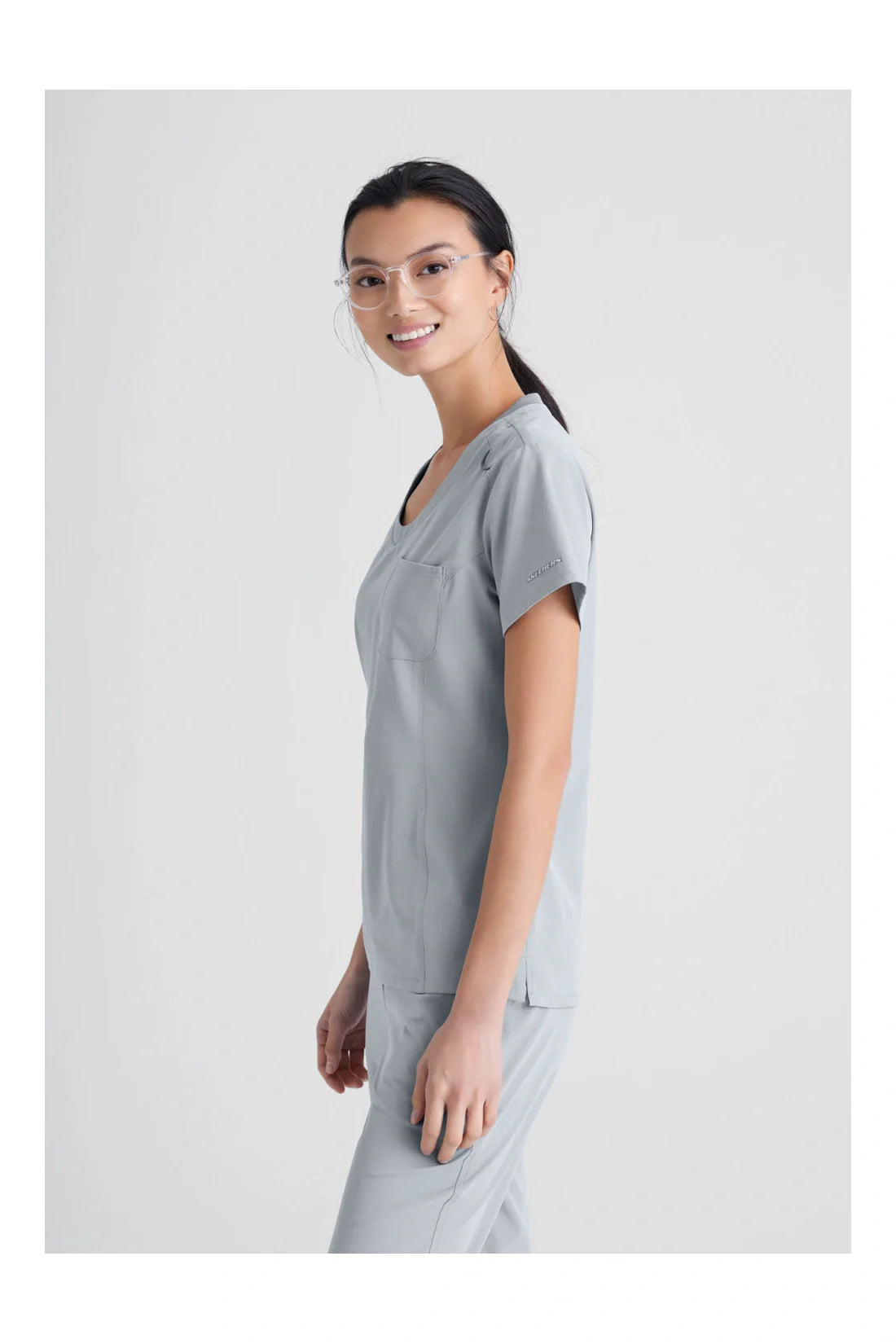 TOP MUJER SKECHERS SKECHERS SKT147 - GRIS CLARO