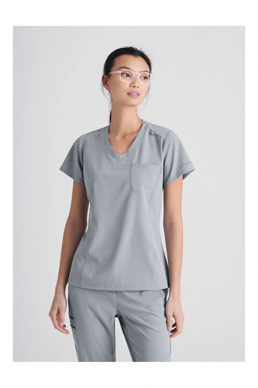 TOP MUJER SKECHERS SKECHERS SKT147 - GRIS CLARO